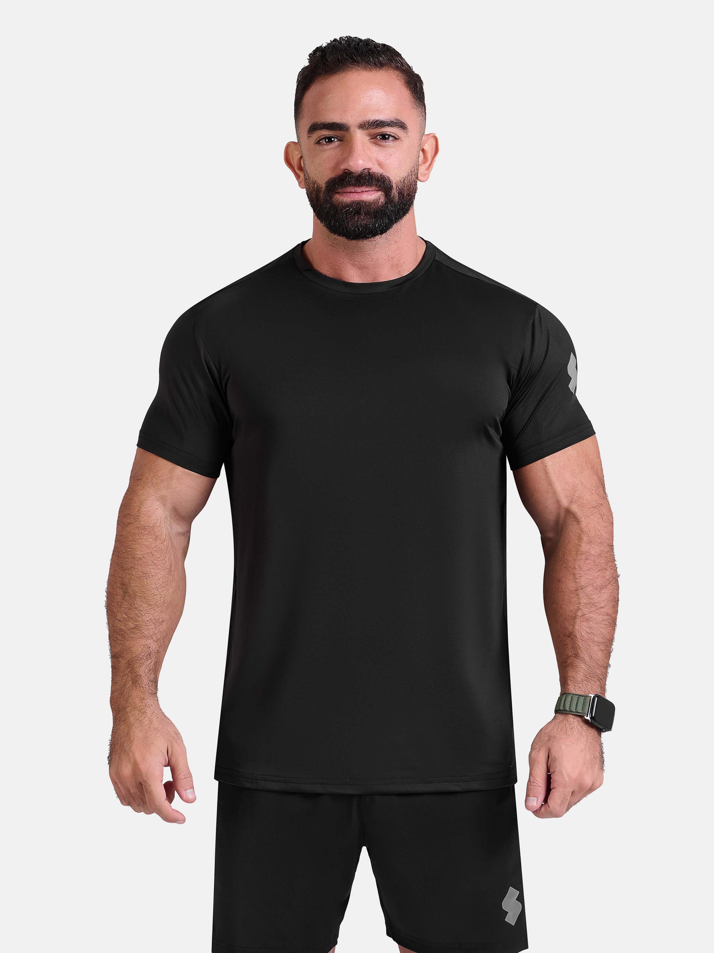 Man wearing black sports - gym - padel t-shirt by KAF Egypt