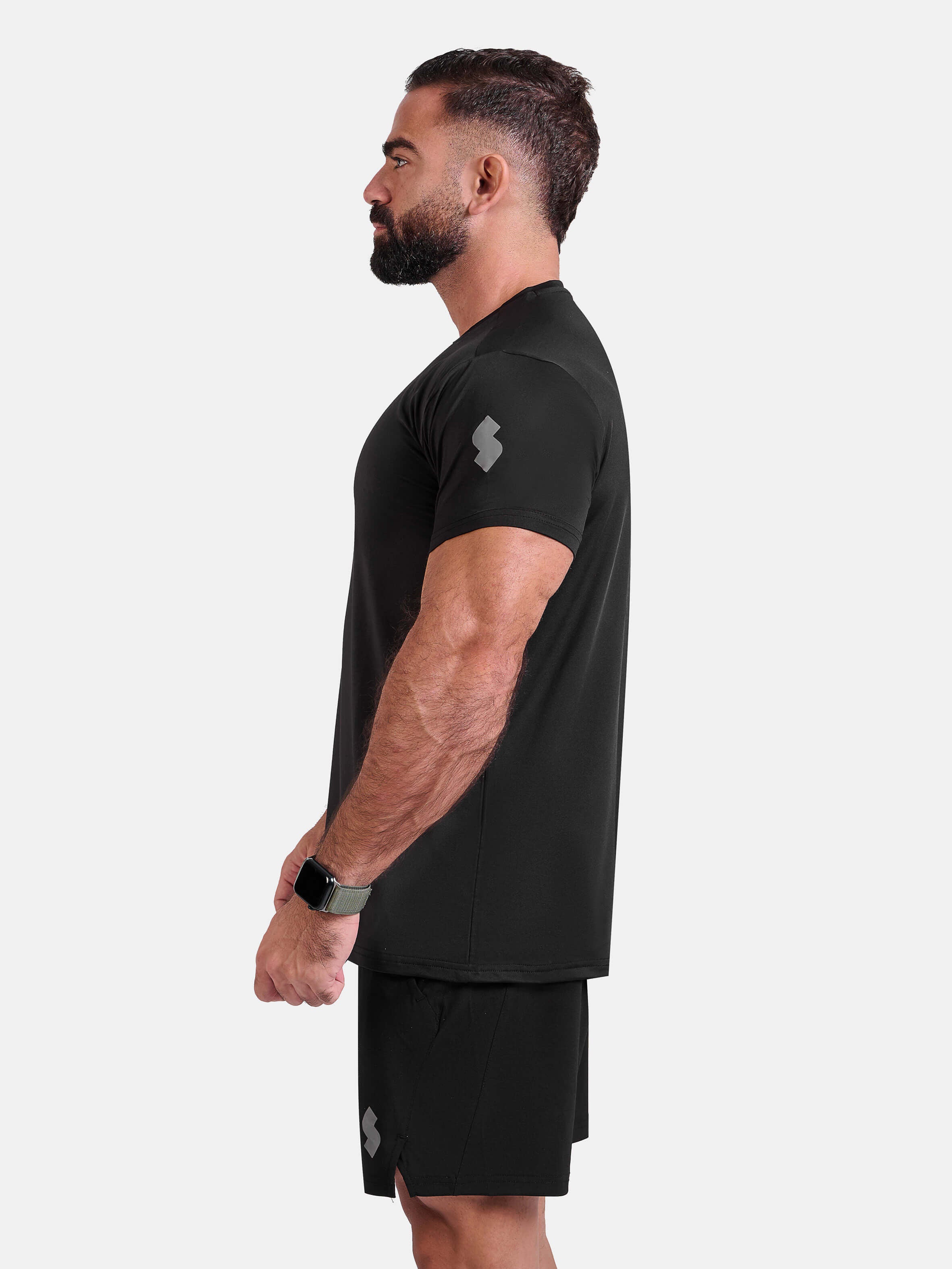 Man wearing black sports - gym - padel t-shirt by KAF Egypt