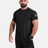 Man wearing black sports - gym - padel t-shirt by KAF Egypt