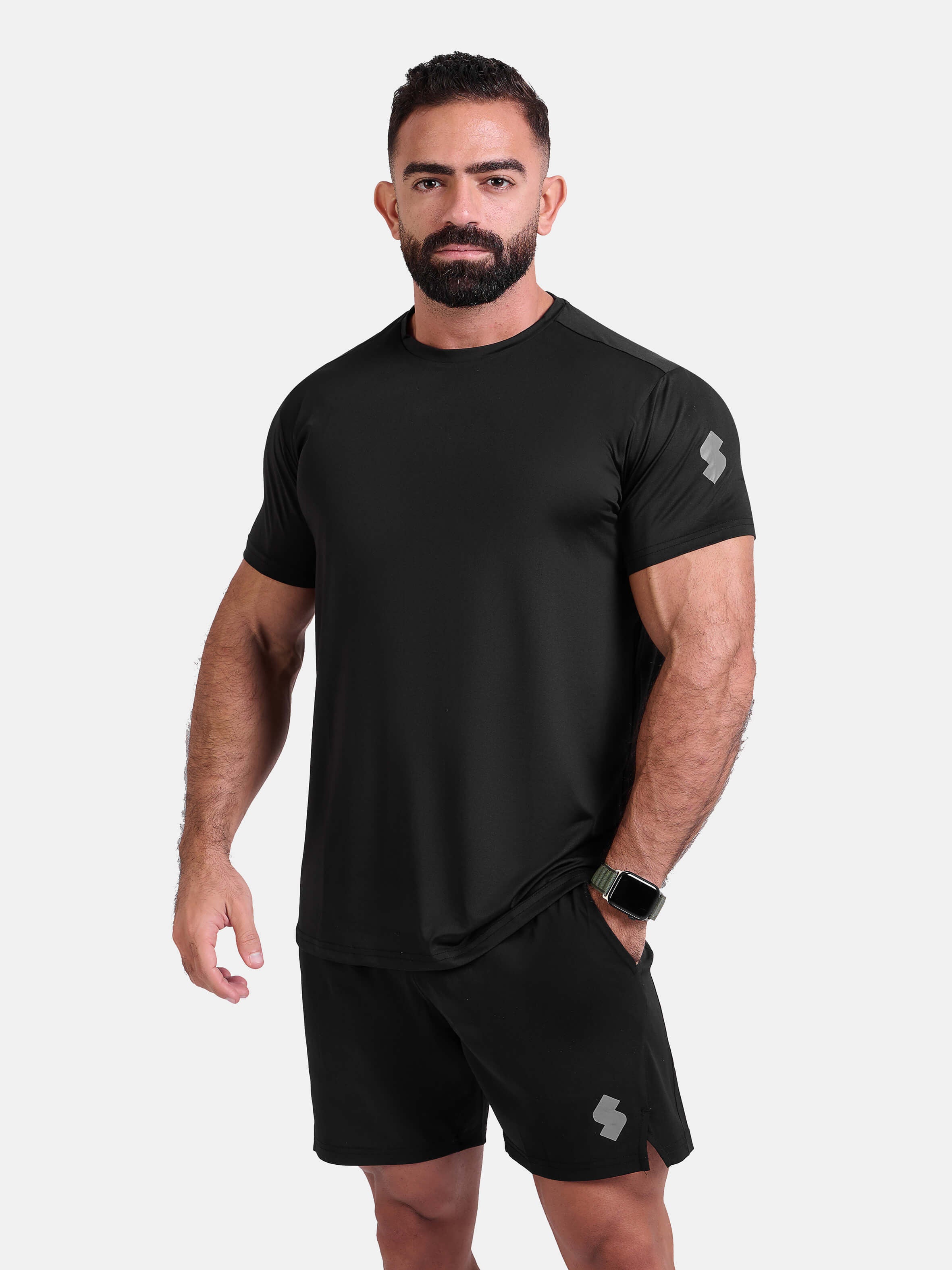 Man wearing black sports - gym - padel t-shirt by KAF Egypt