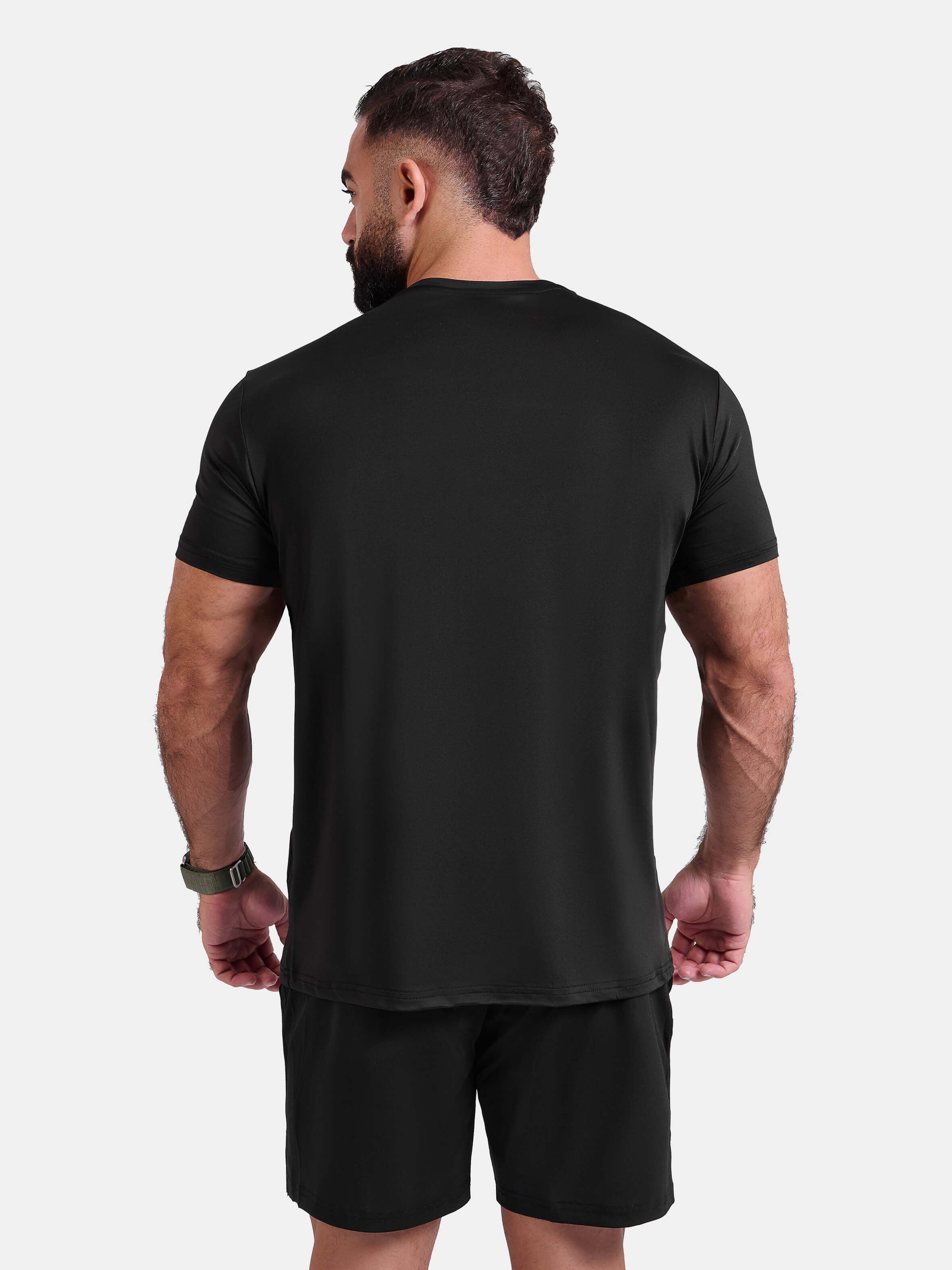 Man wearing black sports - gym - padel t-shirt by KAF Egypt
