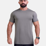 Man wearing sage sports - gym - padel t-shirt by KAF Egypt