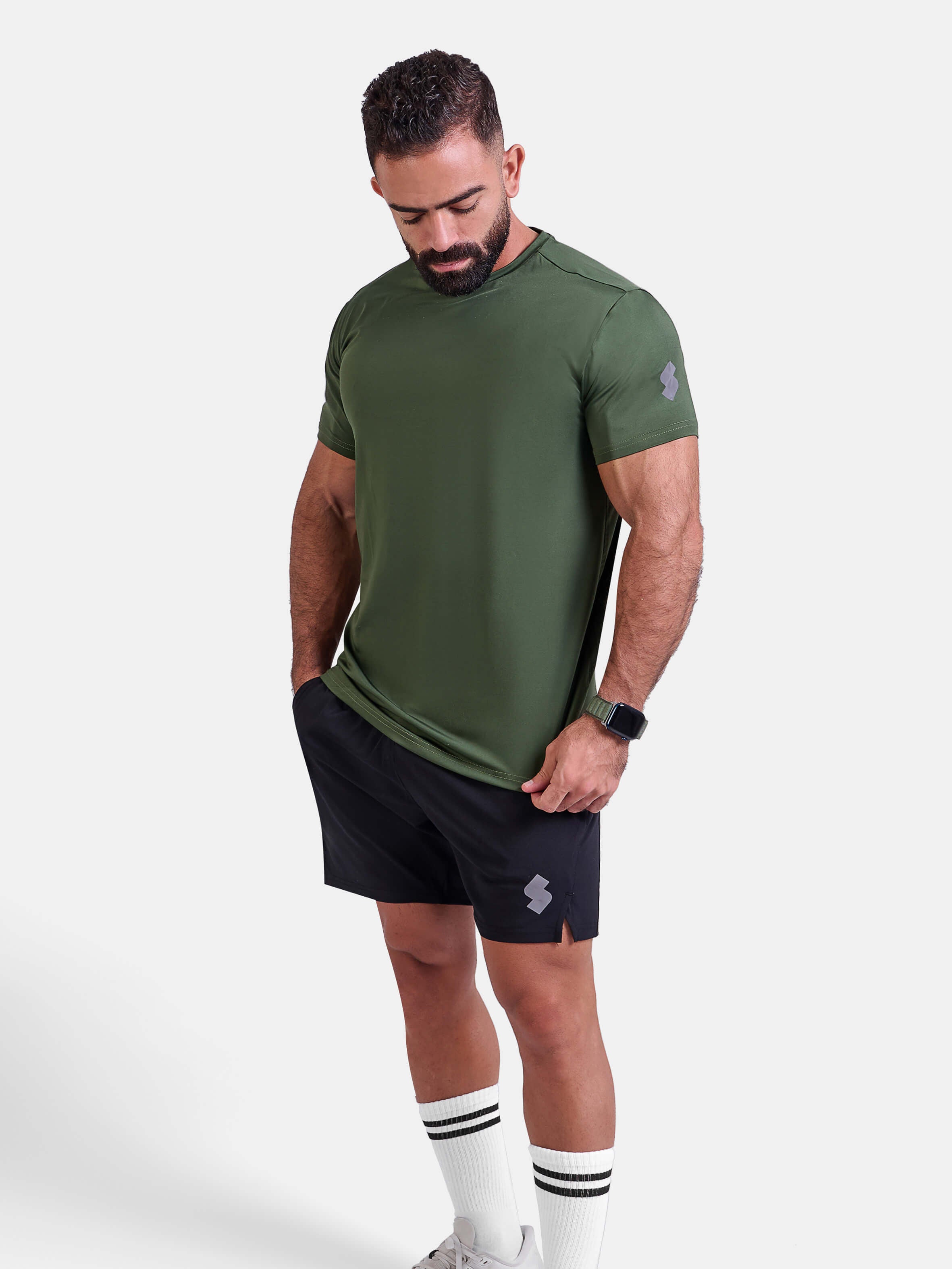 Man wearing green sports - gym - padel t-shirt by KAF Egypt