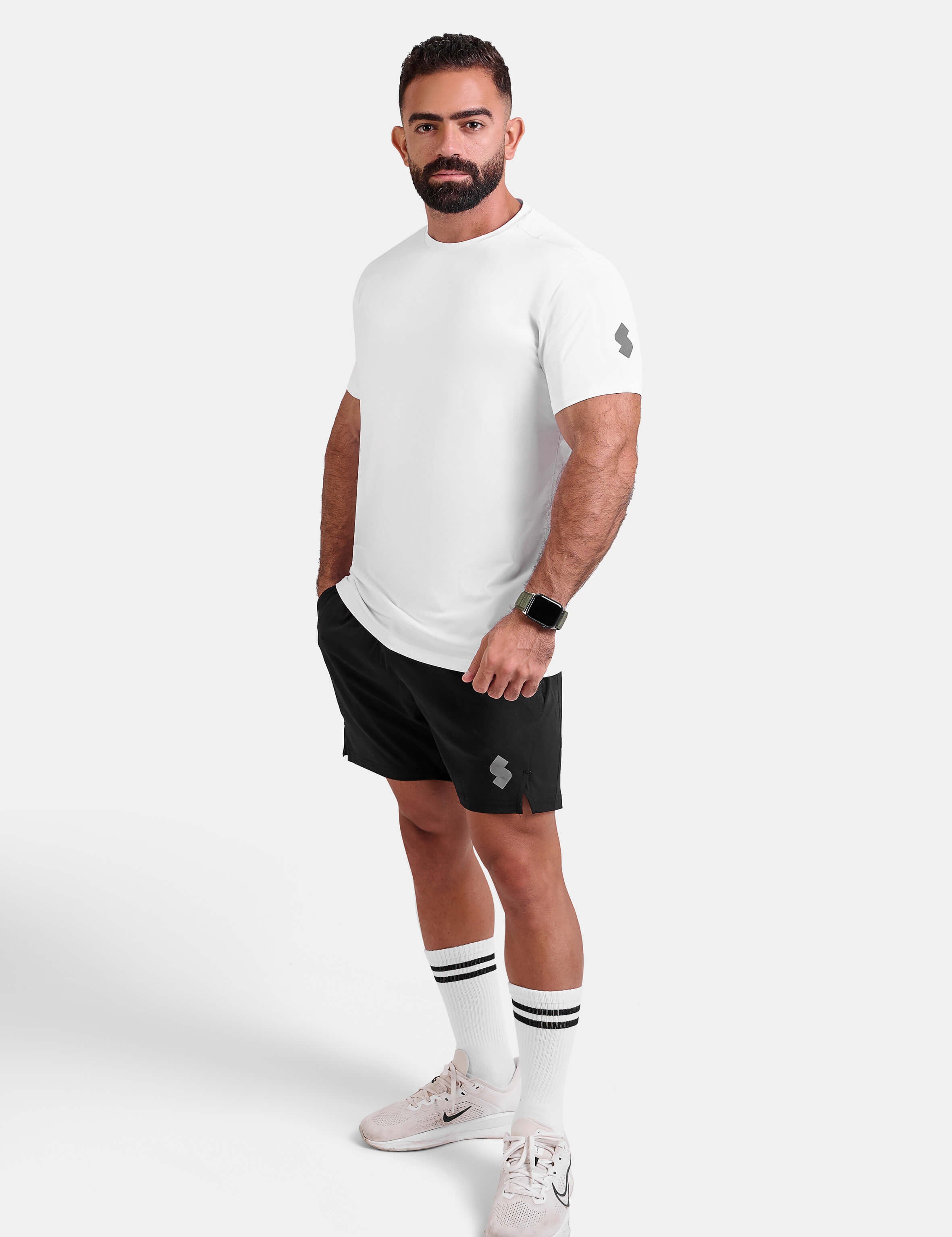 Man wearing white sports - gym - padel t-shirt by KAF Egypt