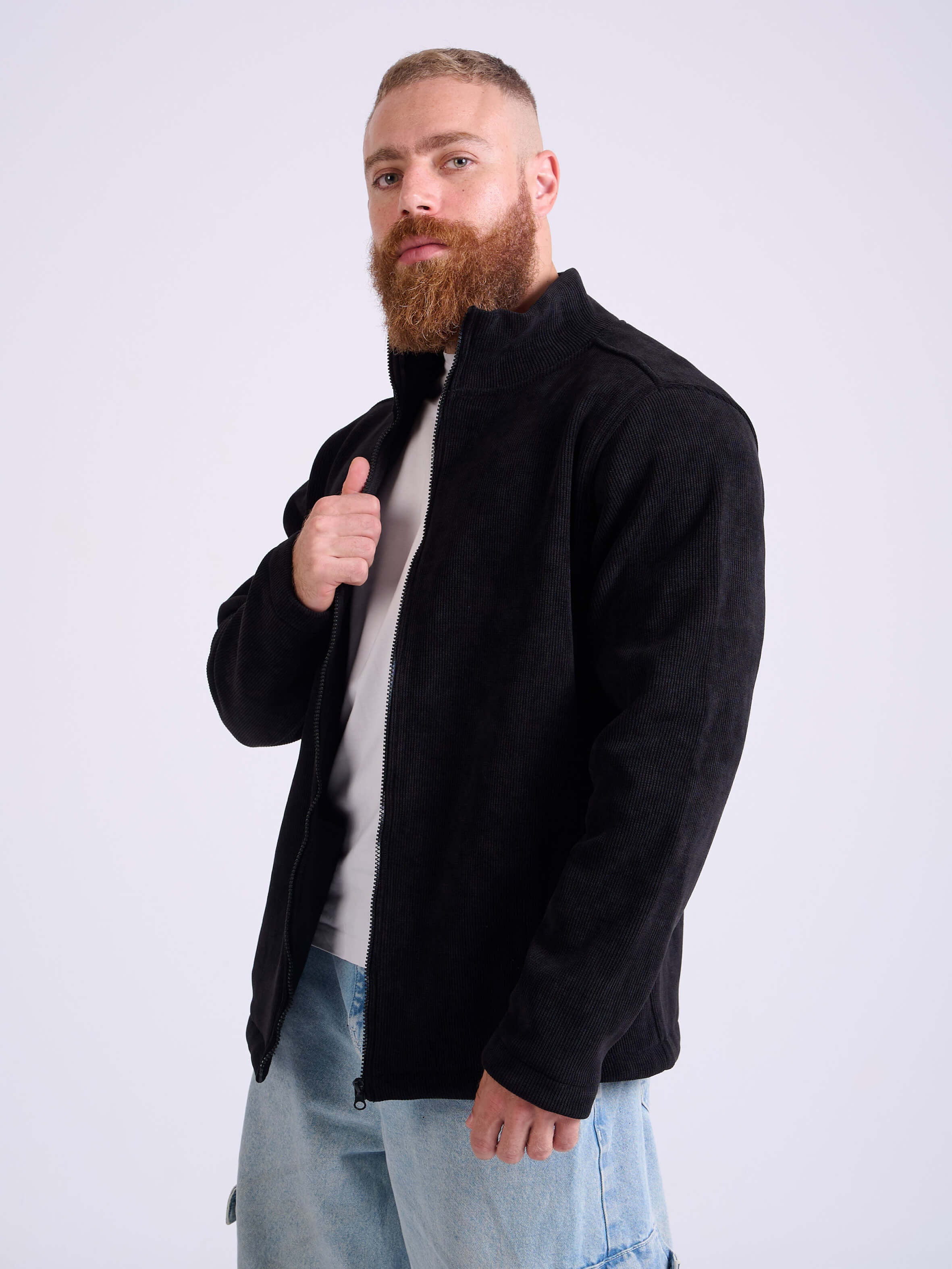 Man wearing a black corduroy jacket by KAF on a white background