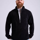 Man wearing a black corduroy jacket by KAF on a white background