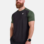 Man wearing black and green sports - gym - padel t-shirt by KAF Egypt