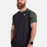 Man wearing black and green sports - gym - padel t-shirt by KAF Egypt