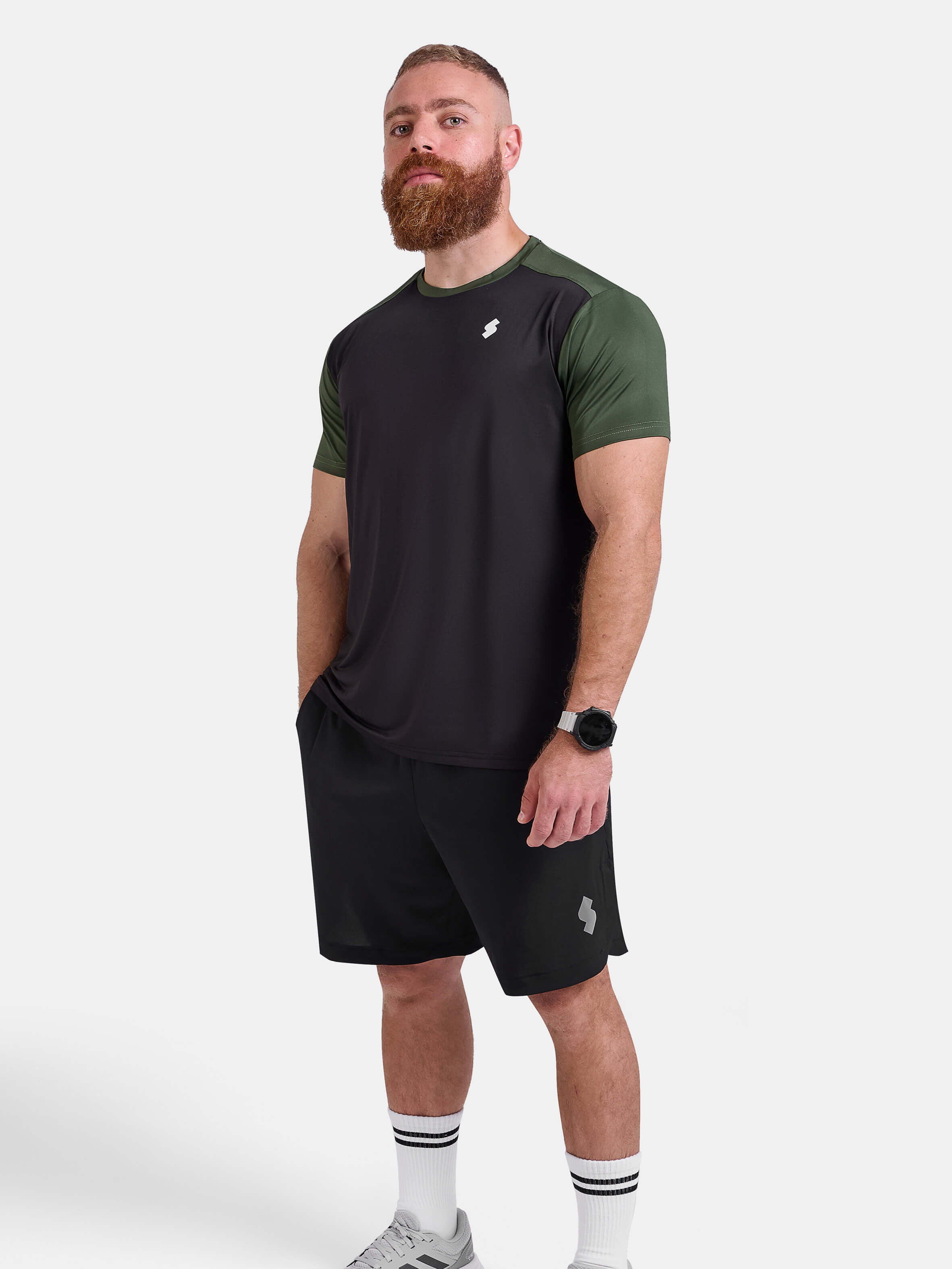 Man wearing black and green sports - gym - padel t-shirt by KAF Egypt