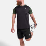 Man wearing black and green sports - gym - padel t-shirt by KAF Egypt