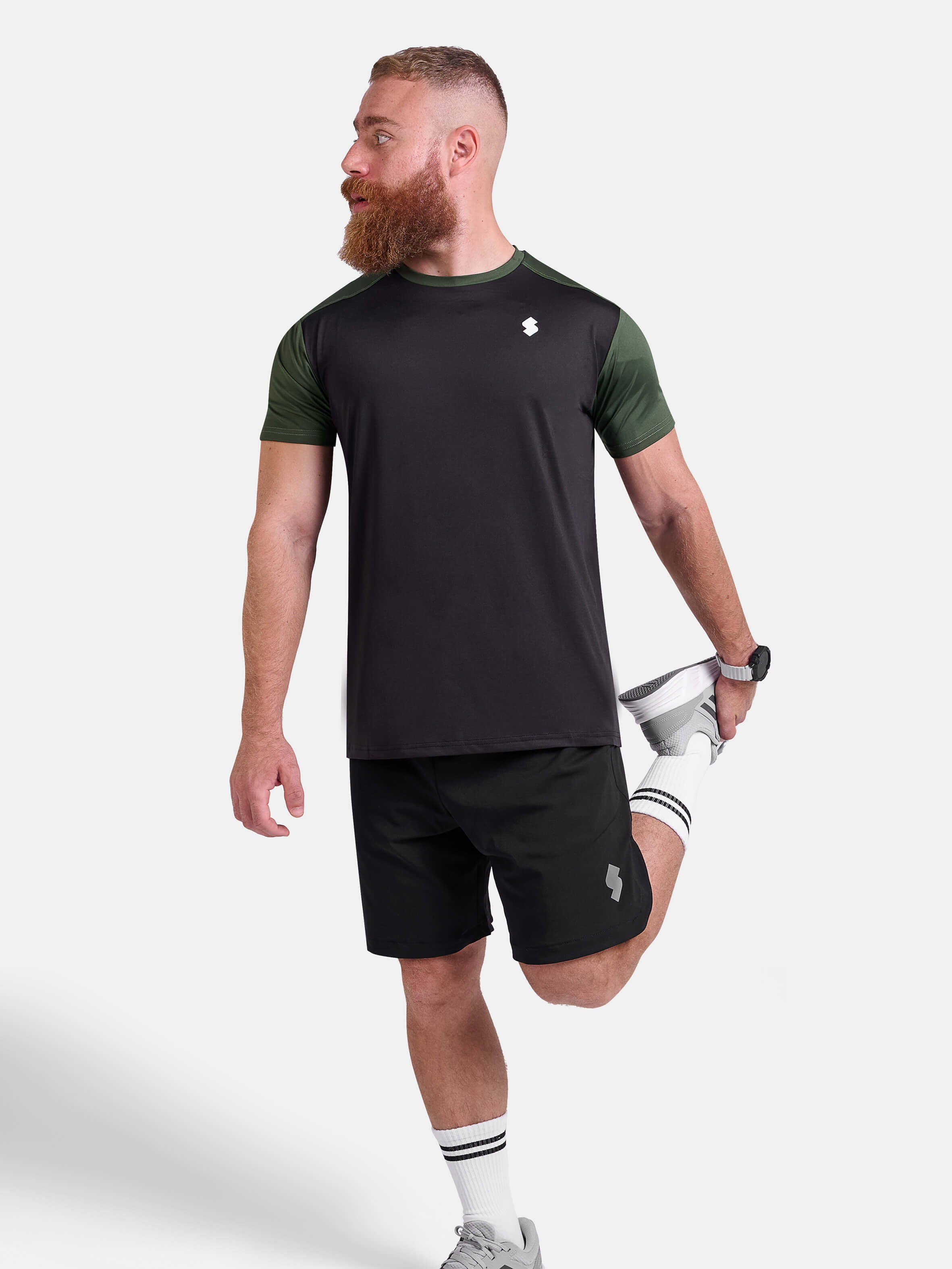 Man wearing black and green sports - gym - padel t-shirt by KAF Egypt