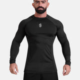 Man wearing black sports & gym rashguard shirt by KAF