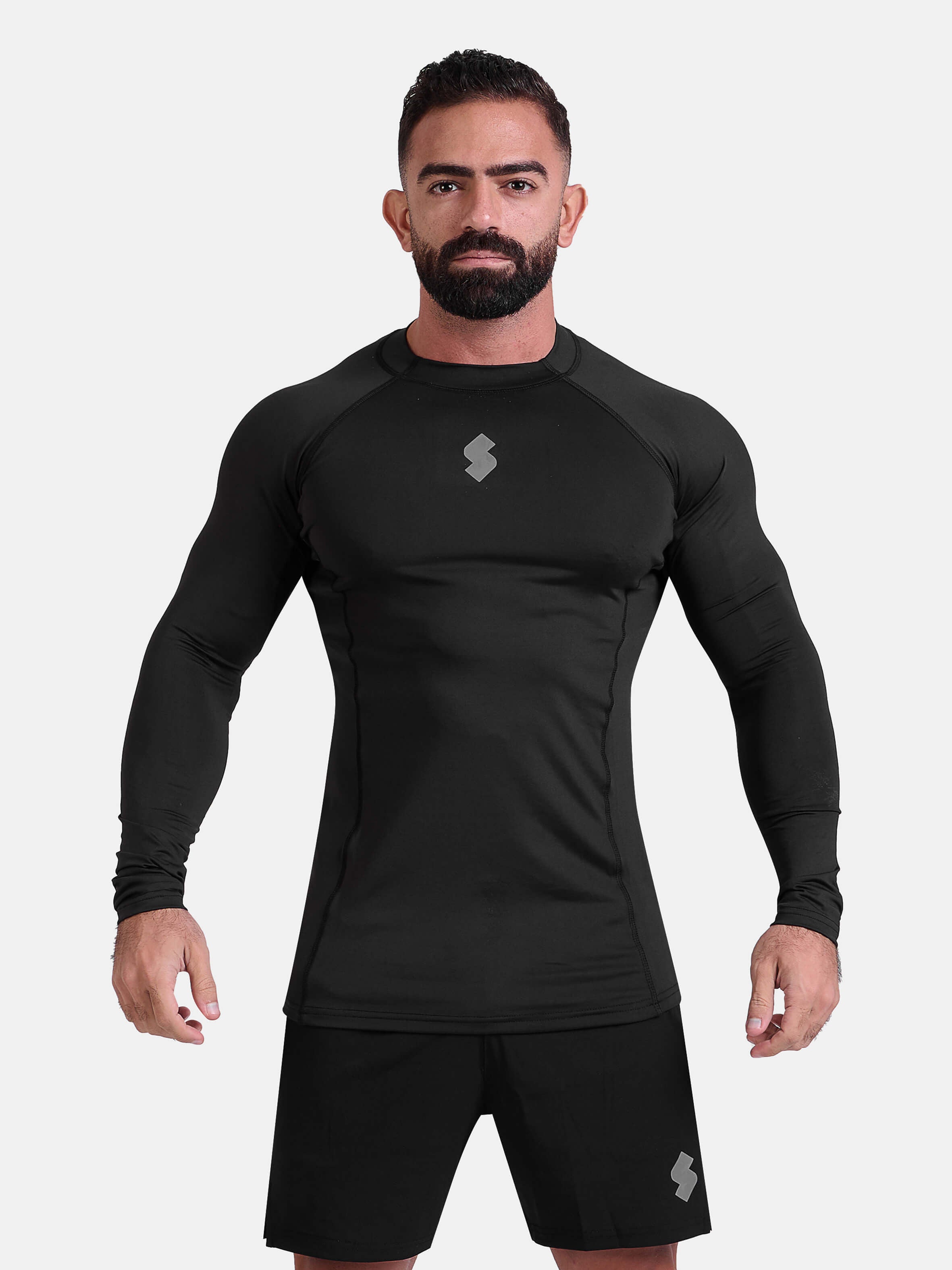 Man wearing black sports & gym rashguard shirt by KAF