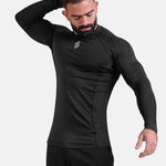 Man wearing black sports & gym rashguard shirt by KAF