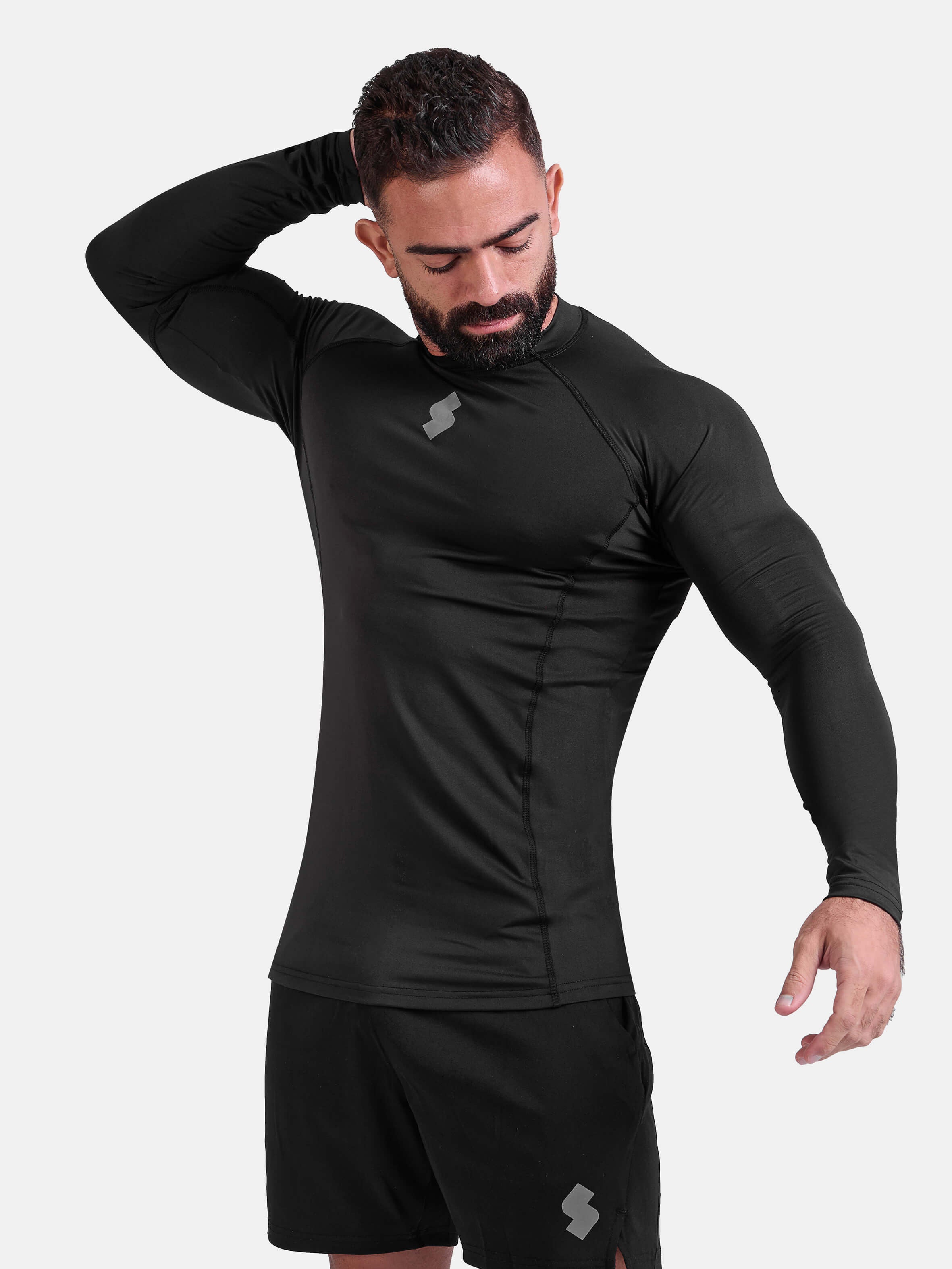 Man wearing black sports & gym rashguard shirt by KAF