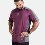 Man wearing a burgundy oversized sports & gym shirt by KAF