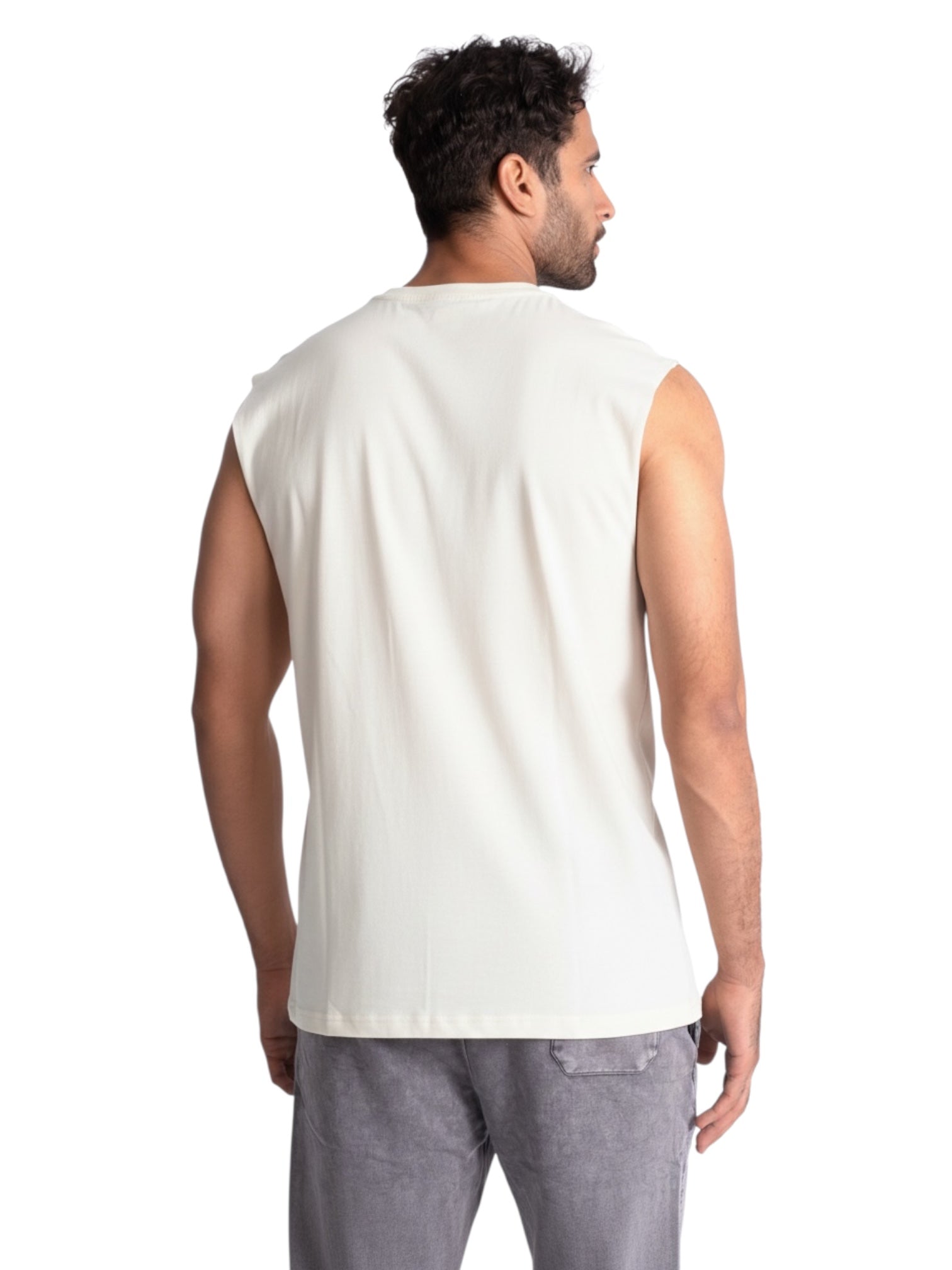 Man wearing a white sleeveless shirt on a white background