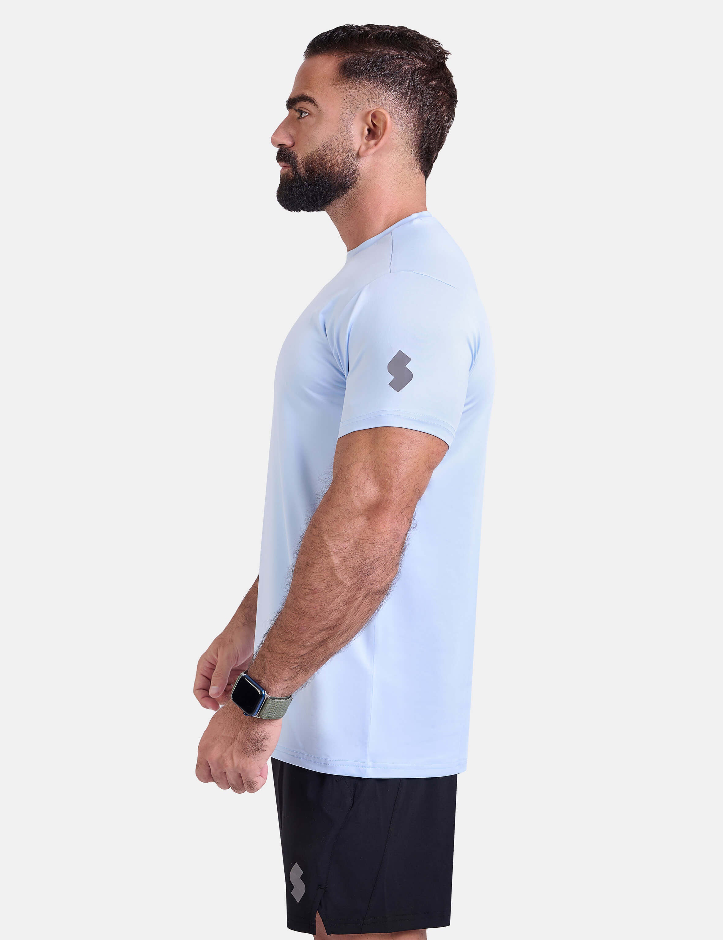 Man wearing light blue sports - gym - padel t-shirt by KAF Egypt