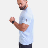 Man wearing light blue sports - gym - padel t-shirt by KAF Egypt