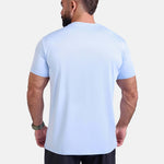 Man wearing light blue sports - gym - padel t-shirt by KAF Egypt
