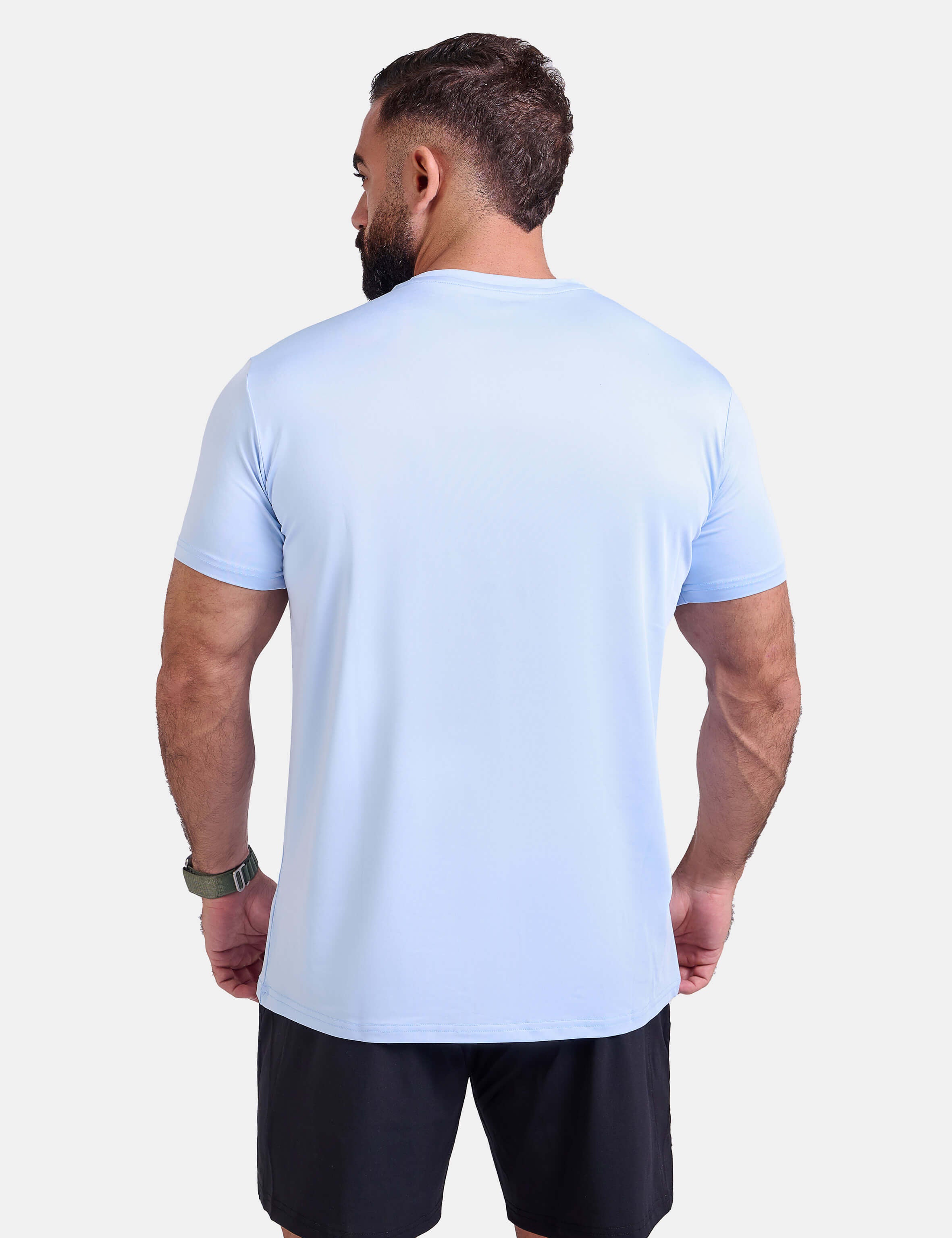Man wearing light blue sports - gym - padel t-shirt by KAF Egypt