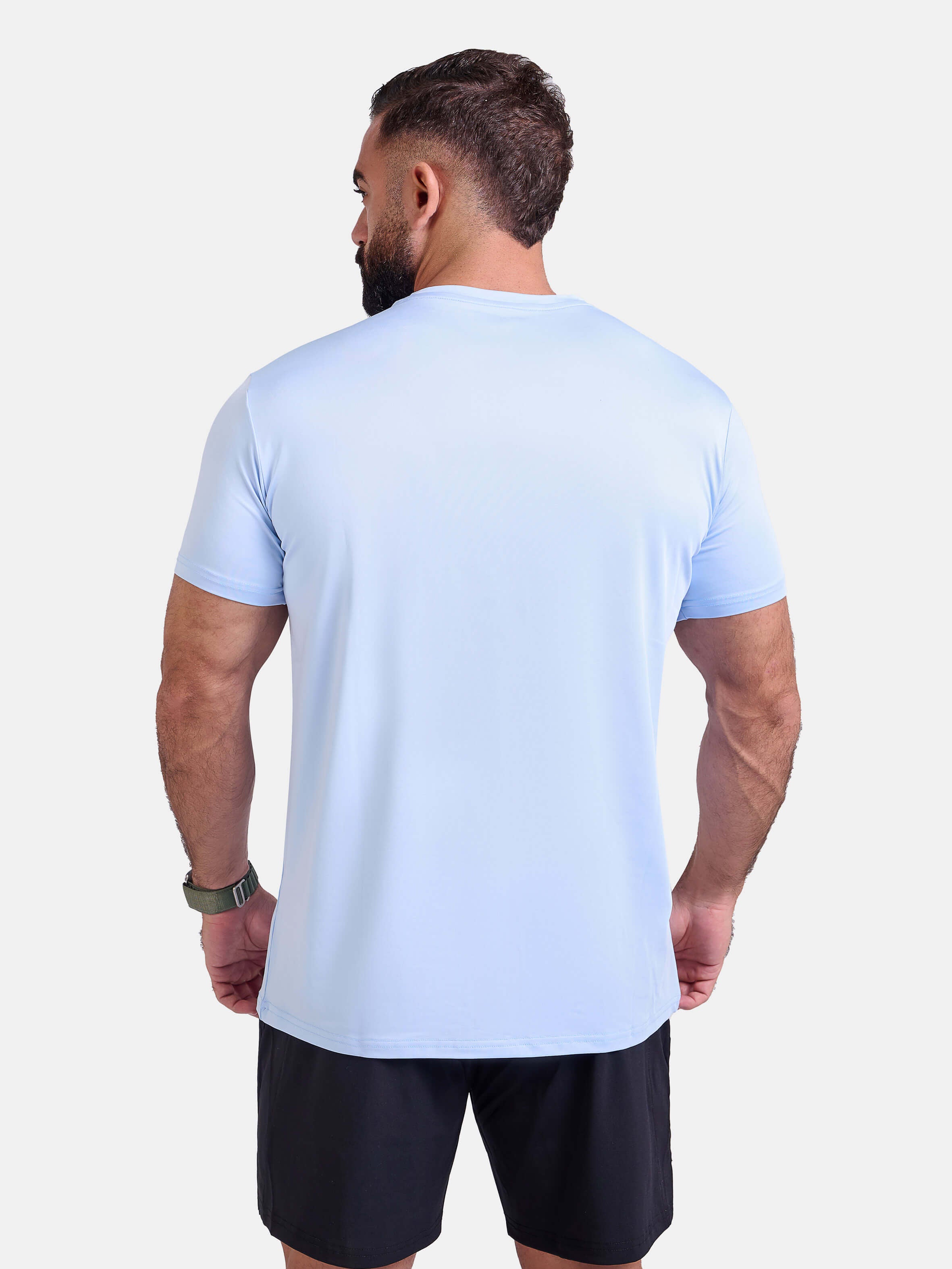 Man wearing light blue sports - gym - padel t-shirt by KAF Egypt