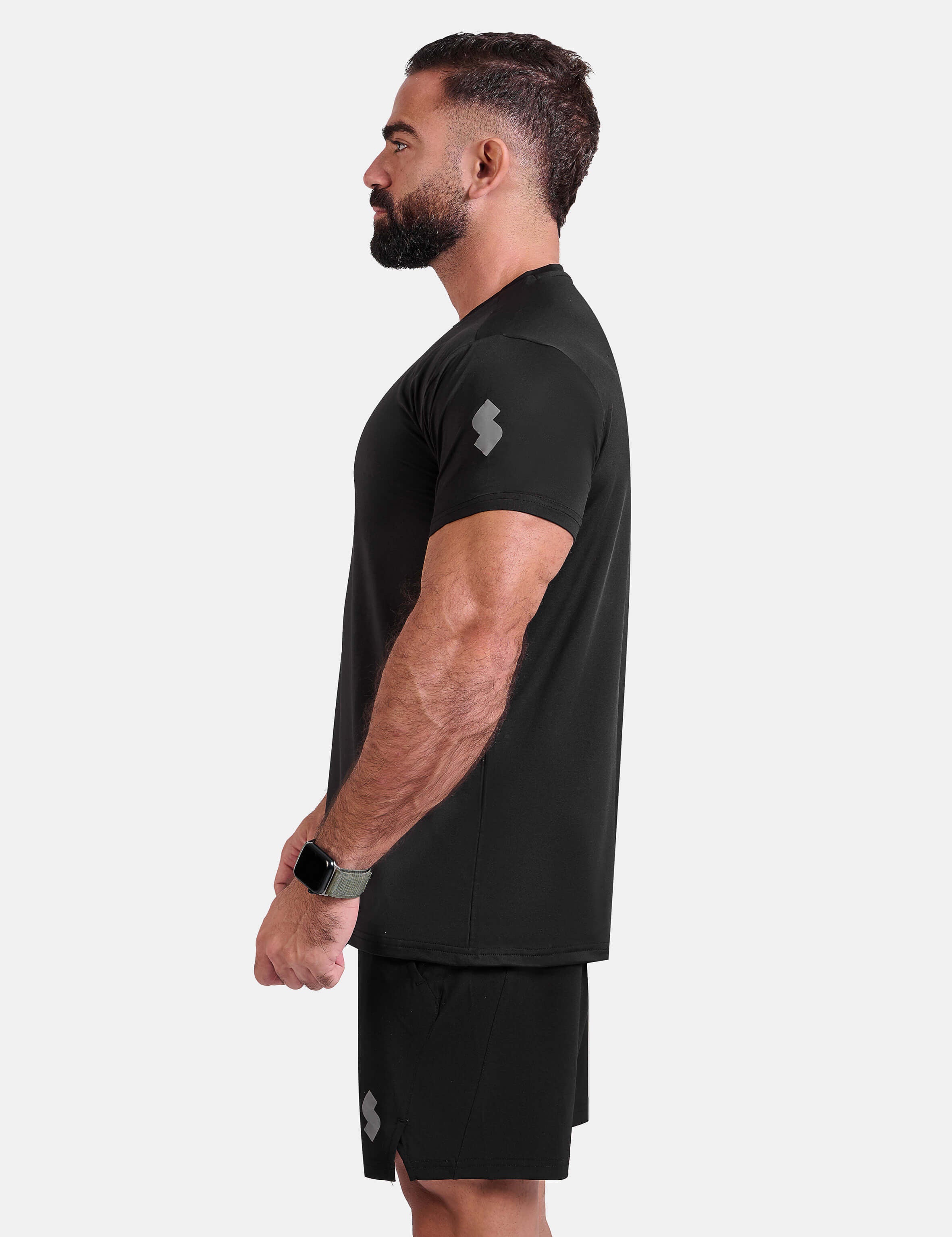 Man wearing black sports - gym - padel t-shirt by KAF Egypt
