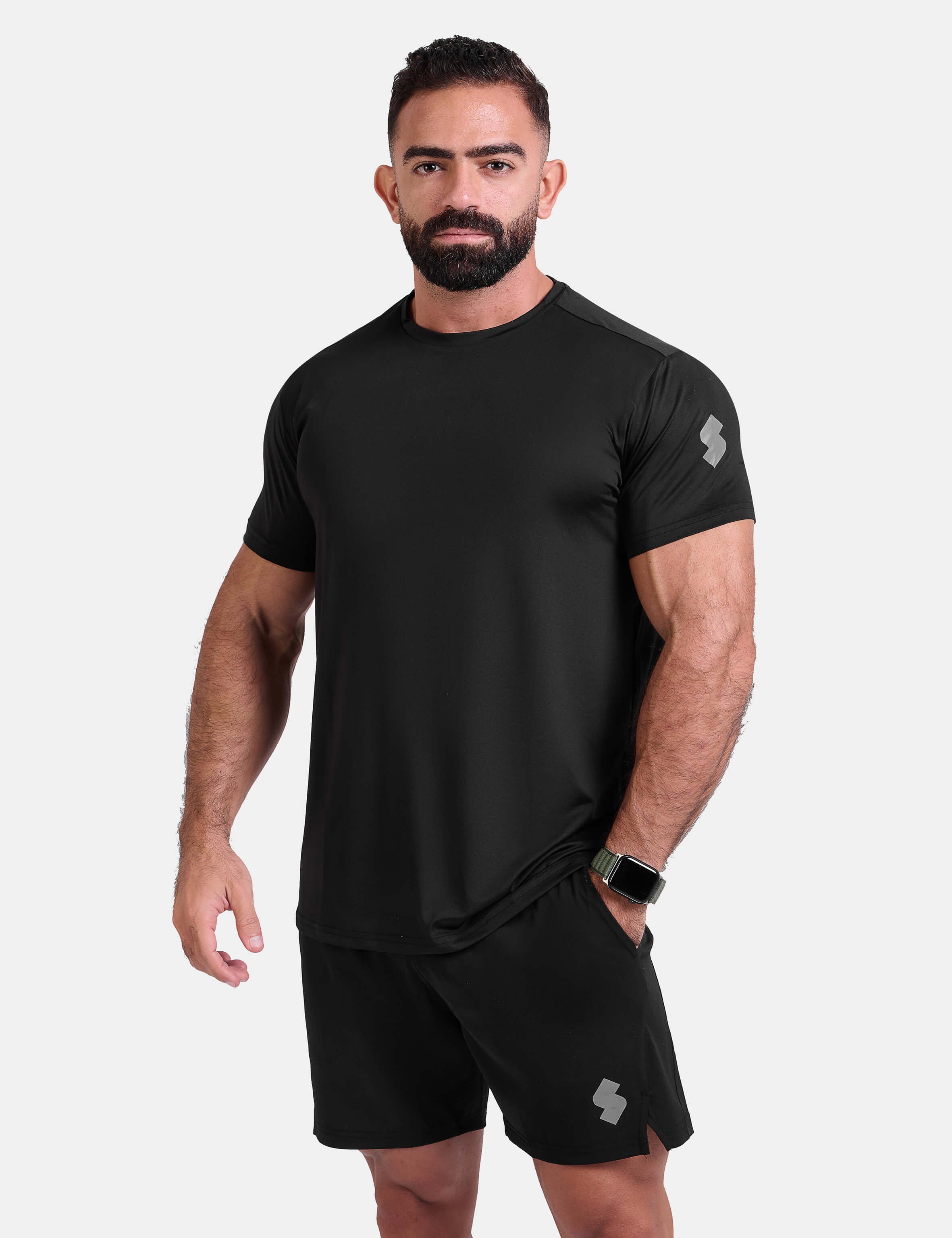 Man wearing black sports - gym - padel t-shirt by KAF Egypt