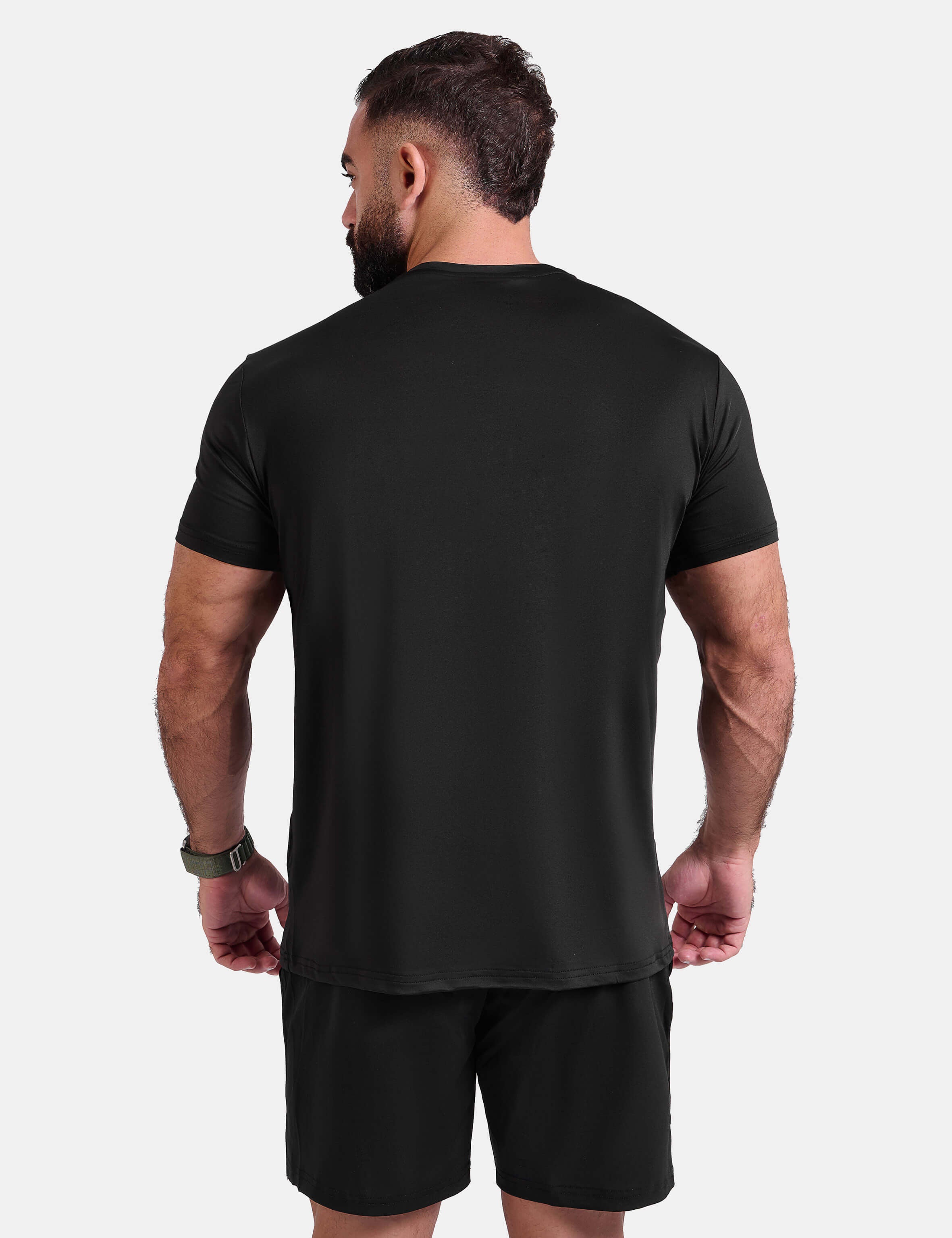 Man wearing black sports - gym - padel t-shirt by KAF Egypt