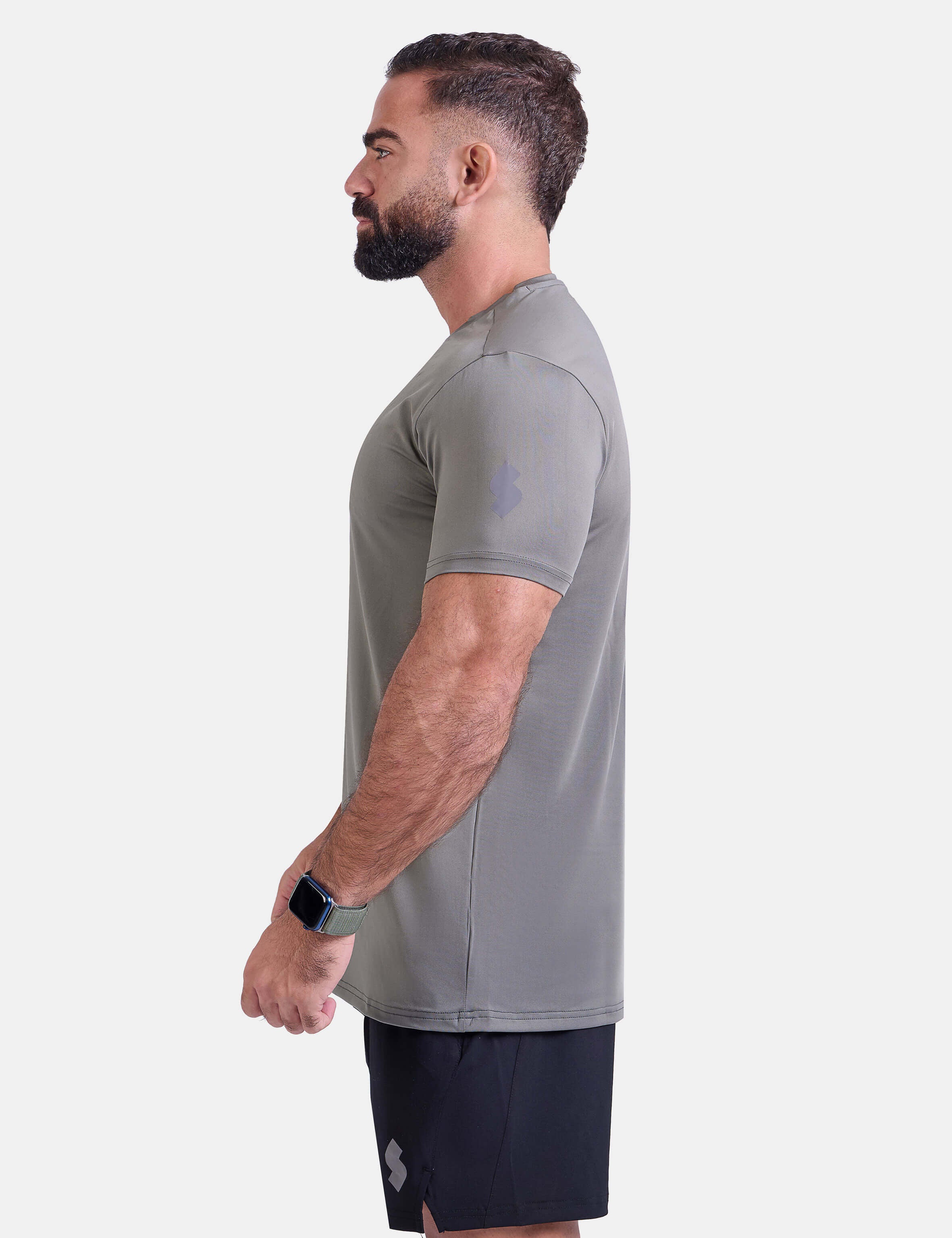 Man wearing sage sports - gym - padel t-shirt by KAF Egypt