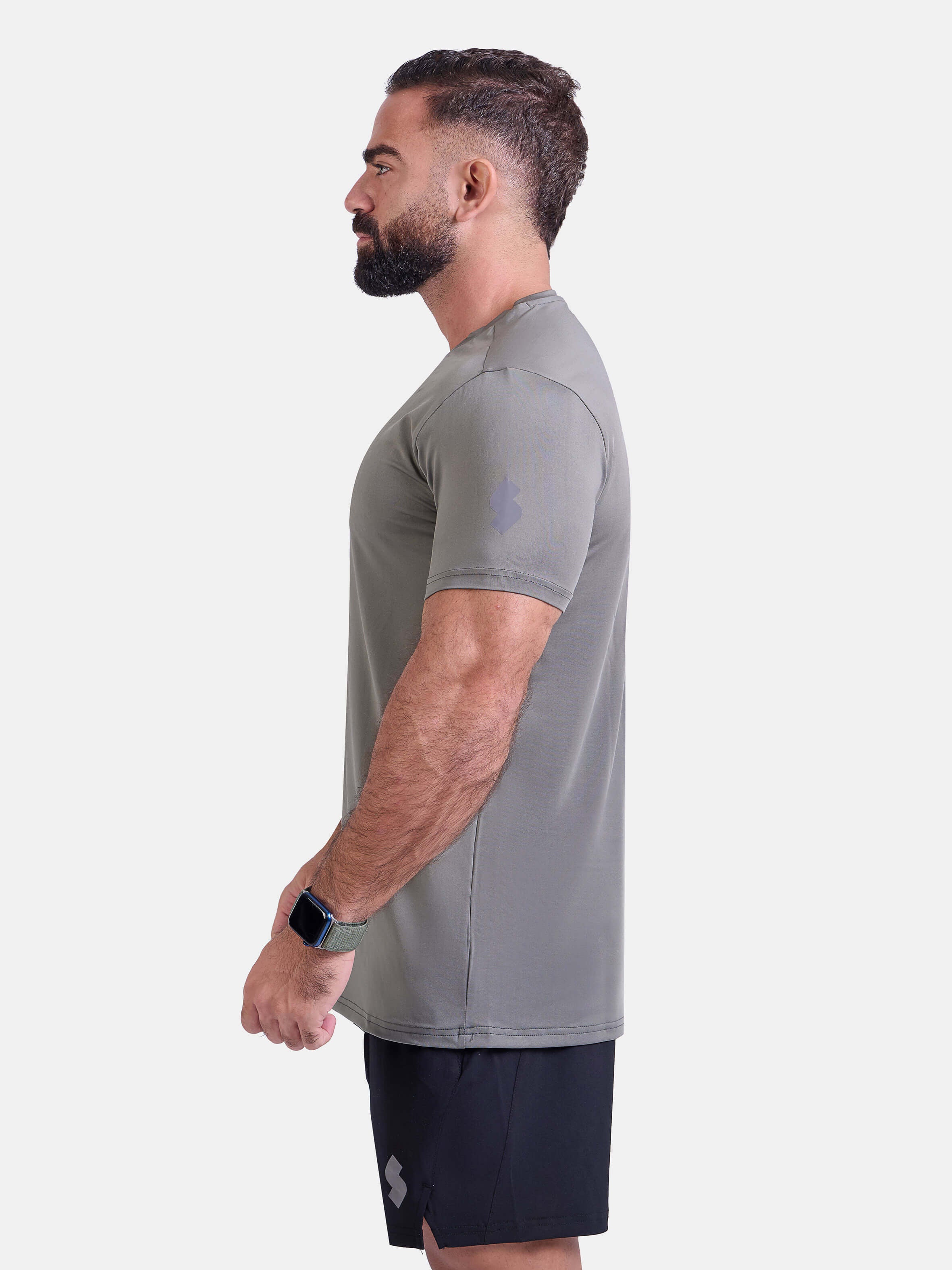 Man wearing sage sports - gym - padel t-shirt by KAF Egypt
