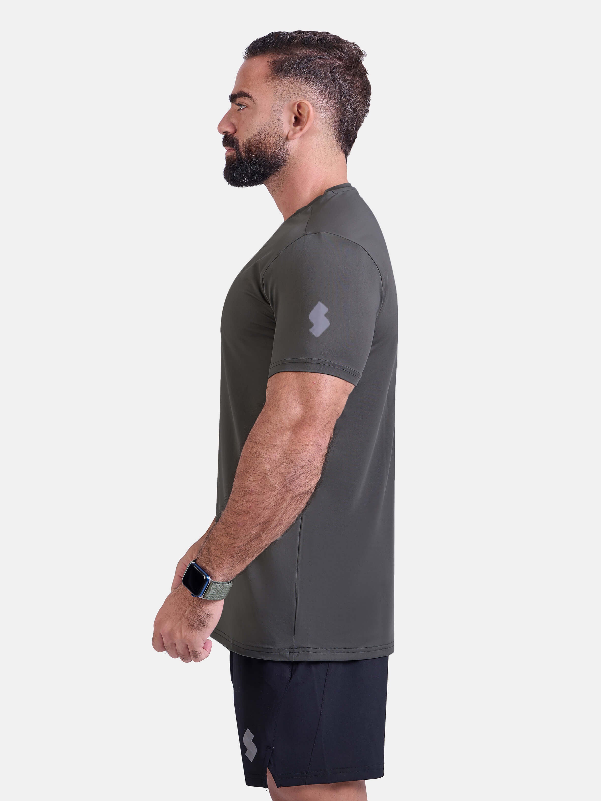 Man wearing dark gray sports - gym - padel t-shirt by KAF Egypt