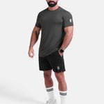 Man wearing dark gray sports - gym - padel t-shirt by KAF Egypt