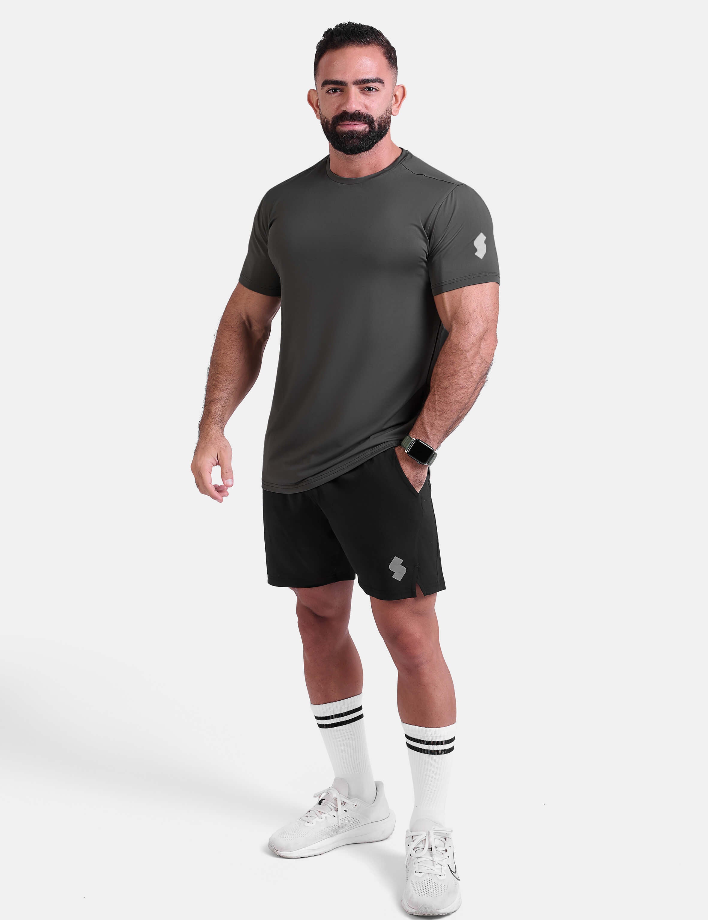 Man wearing dark gray sports - gym - padel t-shirt by KAF Egypt