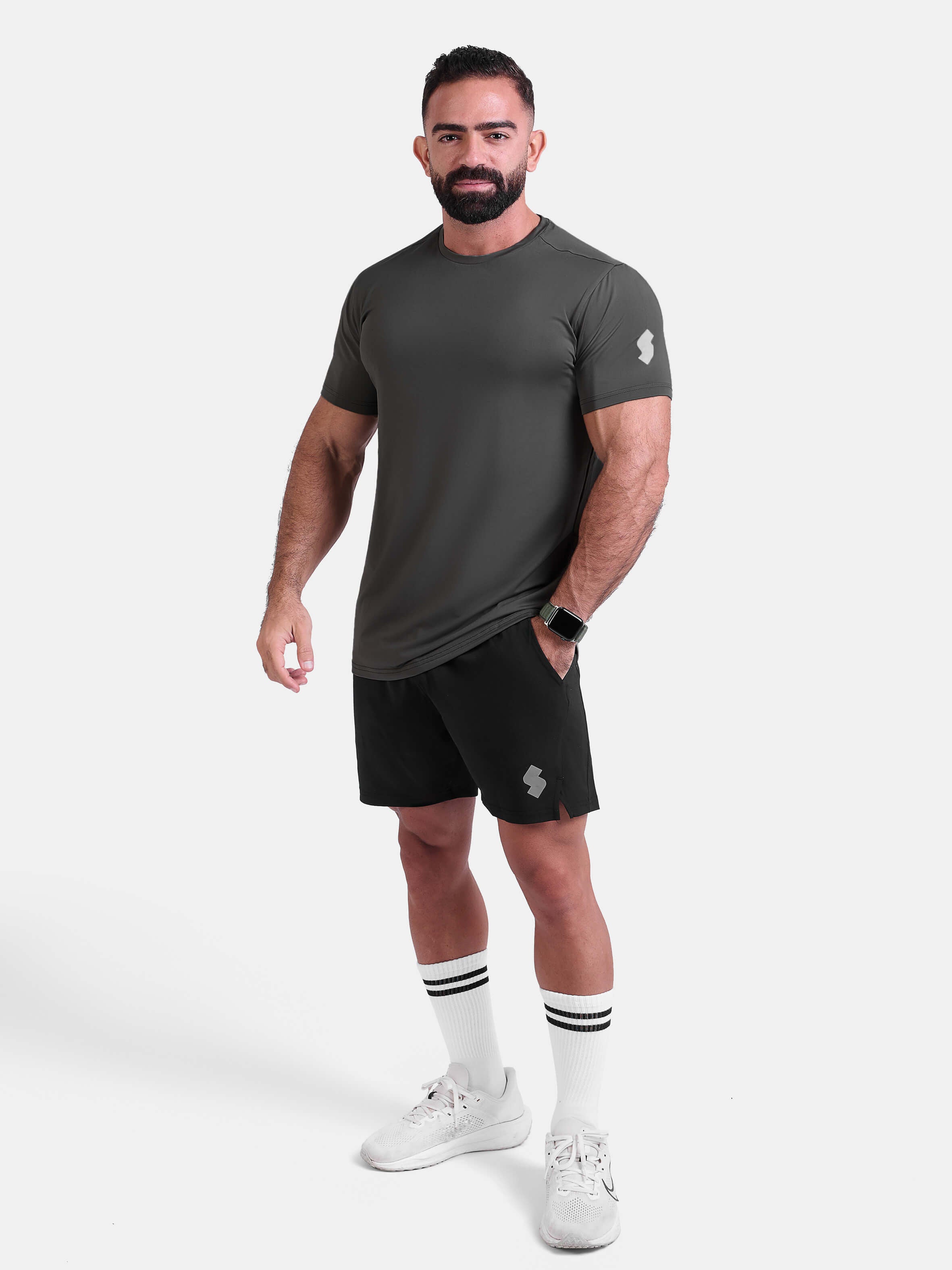 Man wearing dark gray sports - gym - padel t-shirt by KAF Egypt