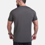 Man wearing dark gray sports - gym - padel t-shirt by KAF Egypt