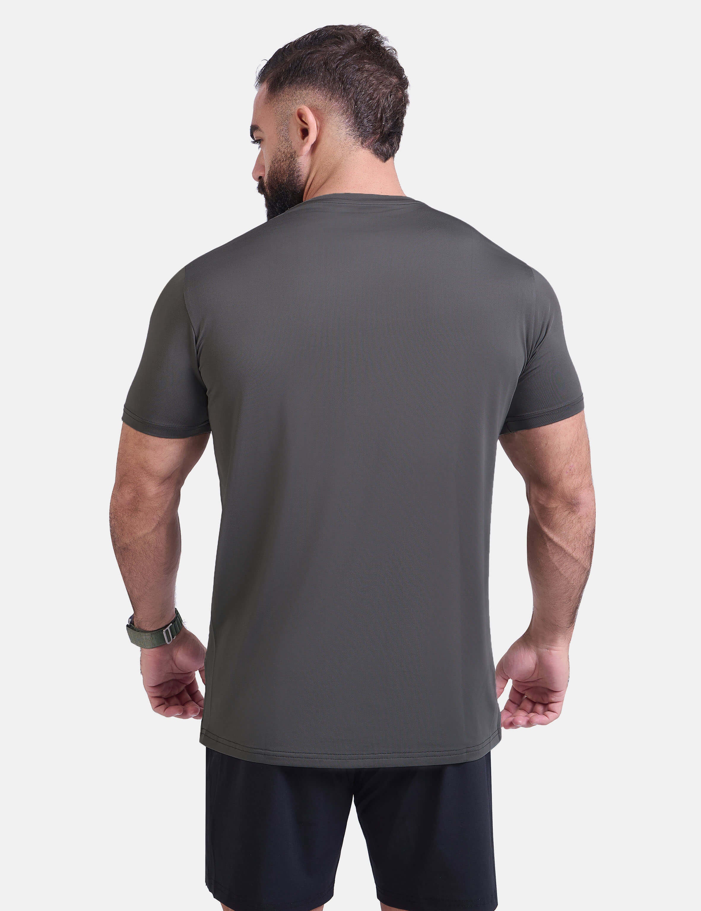 Man wearing dark gray sports - gym - padel t-shirt by KAF Egypt