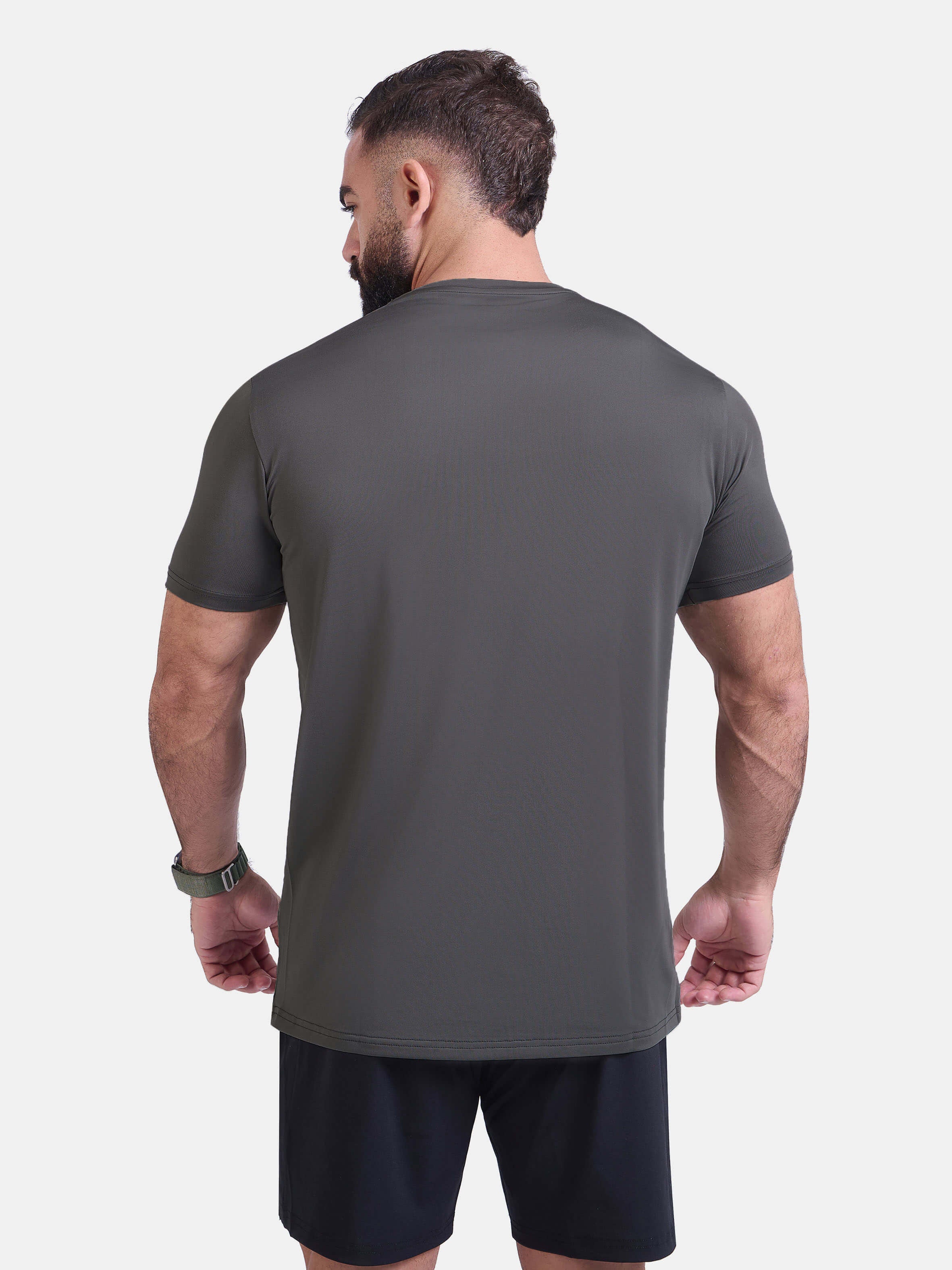Man wearing dark gray sports - gym - padel t-shirt by KAF Egypt