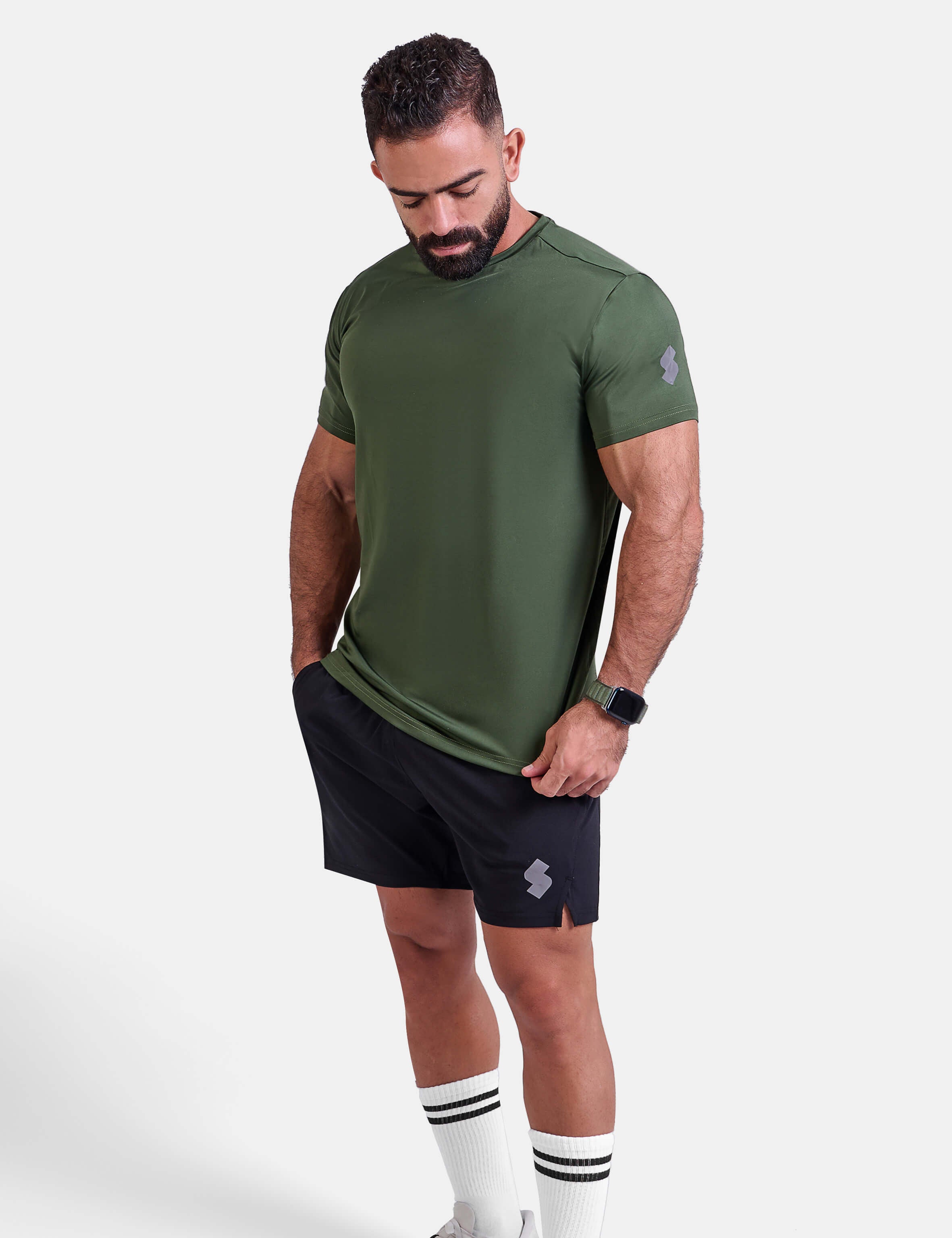 Man wearing green sports - gym - padel t-shirt by KAF Egypt