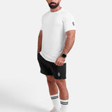 Man wearing white sports - gym - padel t-shirt by KAF Egypt