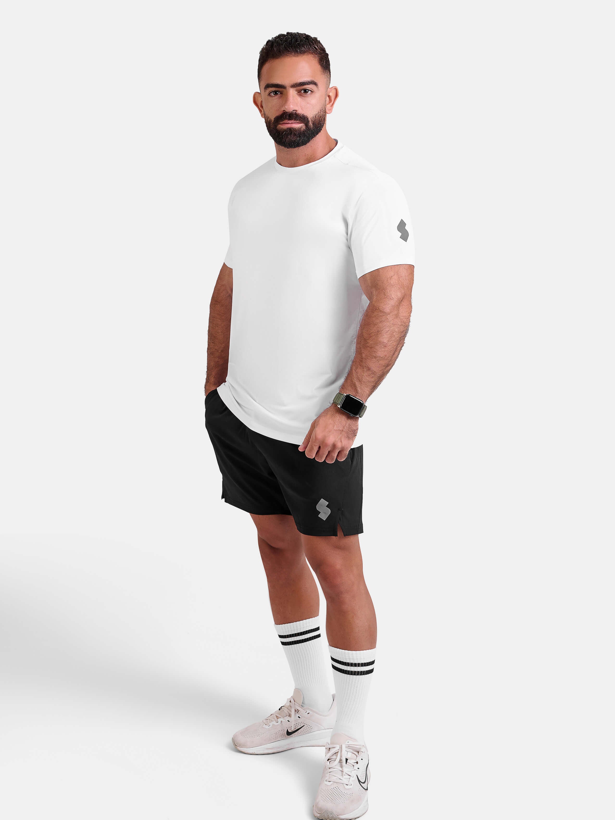 Man wearing white sports - gym - padel t-shirt by KAF Egypt