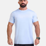 Man wearing light blue sports - gym - padel t-shirt by KAF Egypt