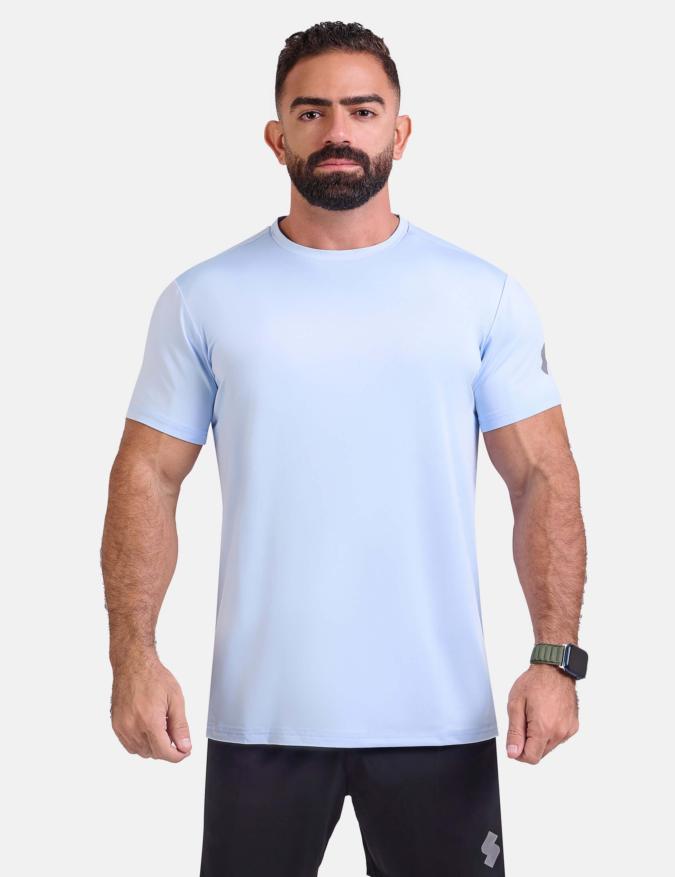 Man wearing light blue sports - gym - padel t-shirt by KAF Egypt
