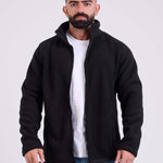 Man wearing a black fleece jacket by KAF on a white background. Made in Egypt