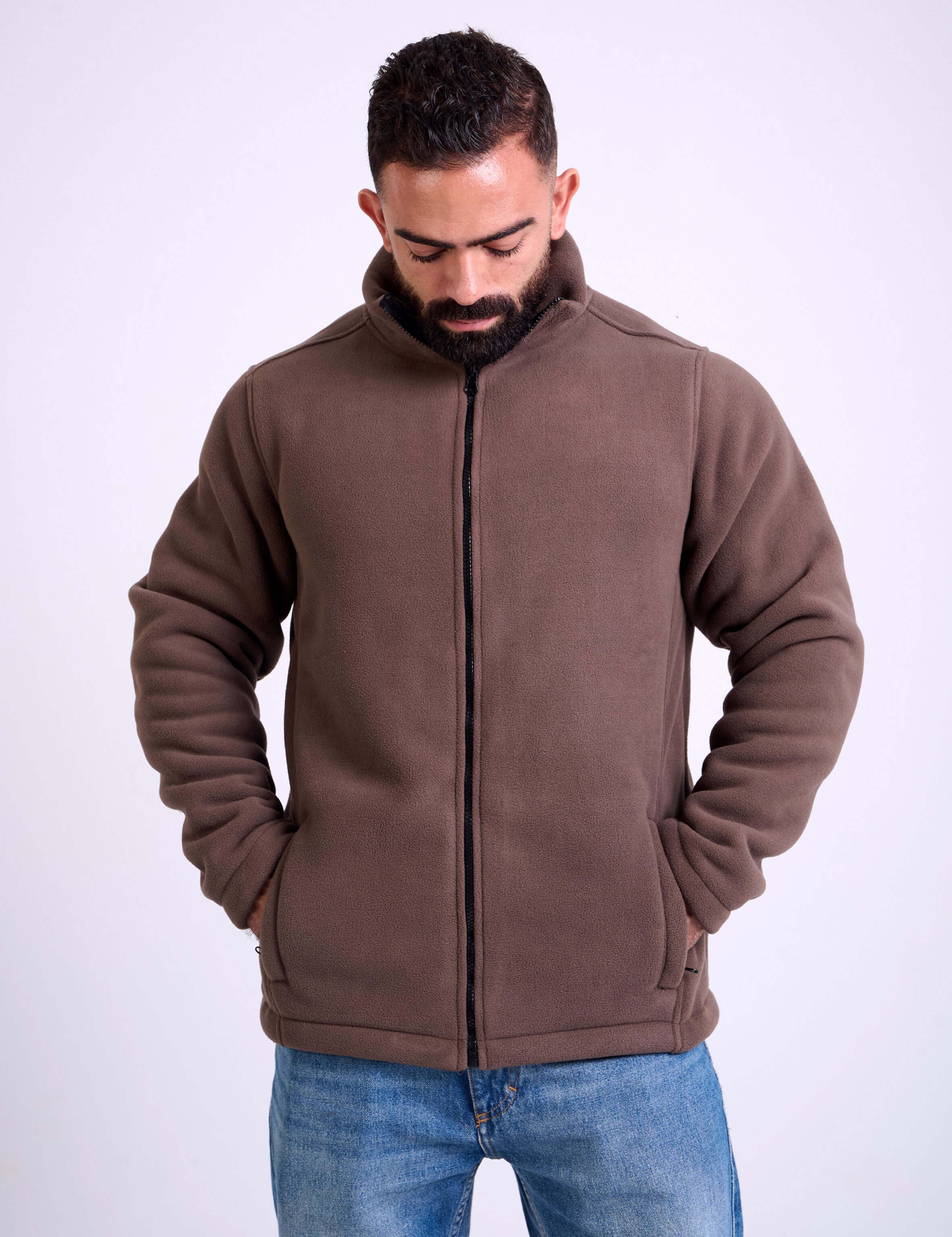 Man wearing a brown fleece jacket by KAF on a white background. Made in Egypt