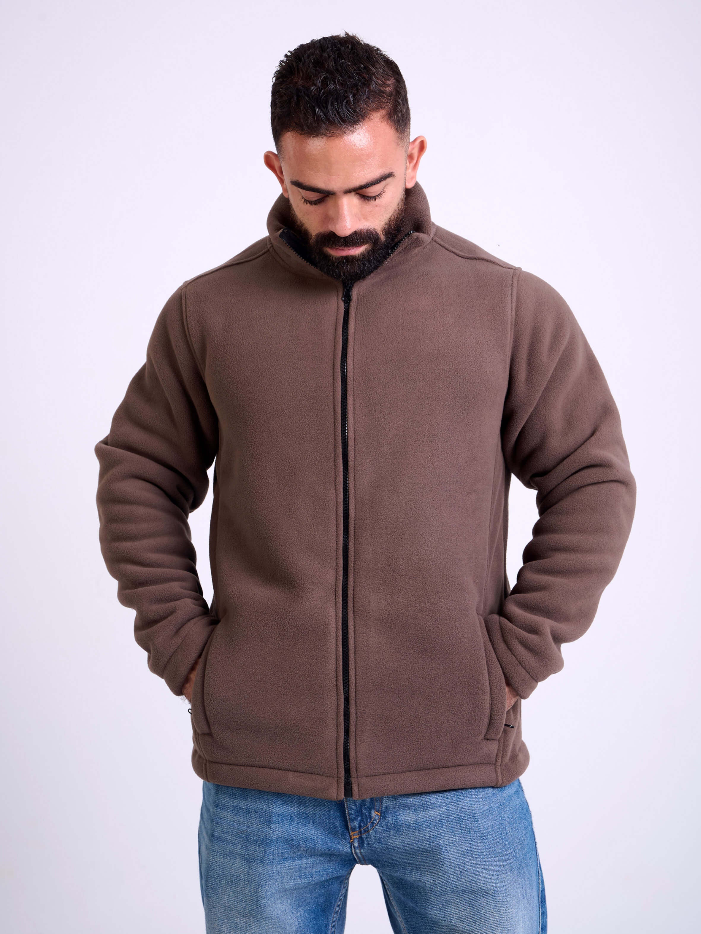 Man wearing a brown fleece jacket by KAF on a white background. Made in Egypt