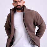 Man wearing a brown fleece jacket by KAF on a white background. Made in Egypt