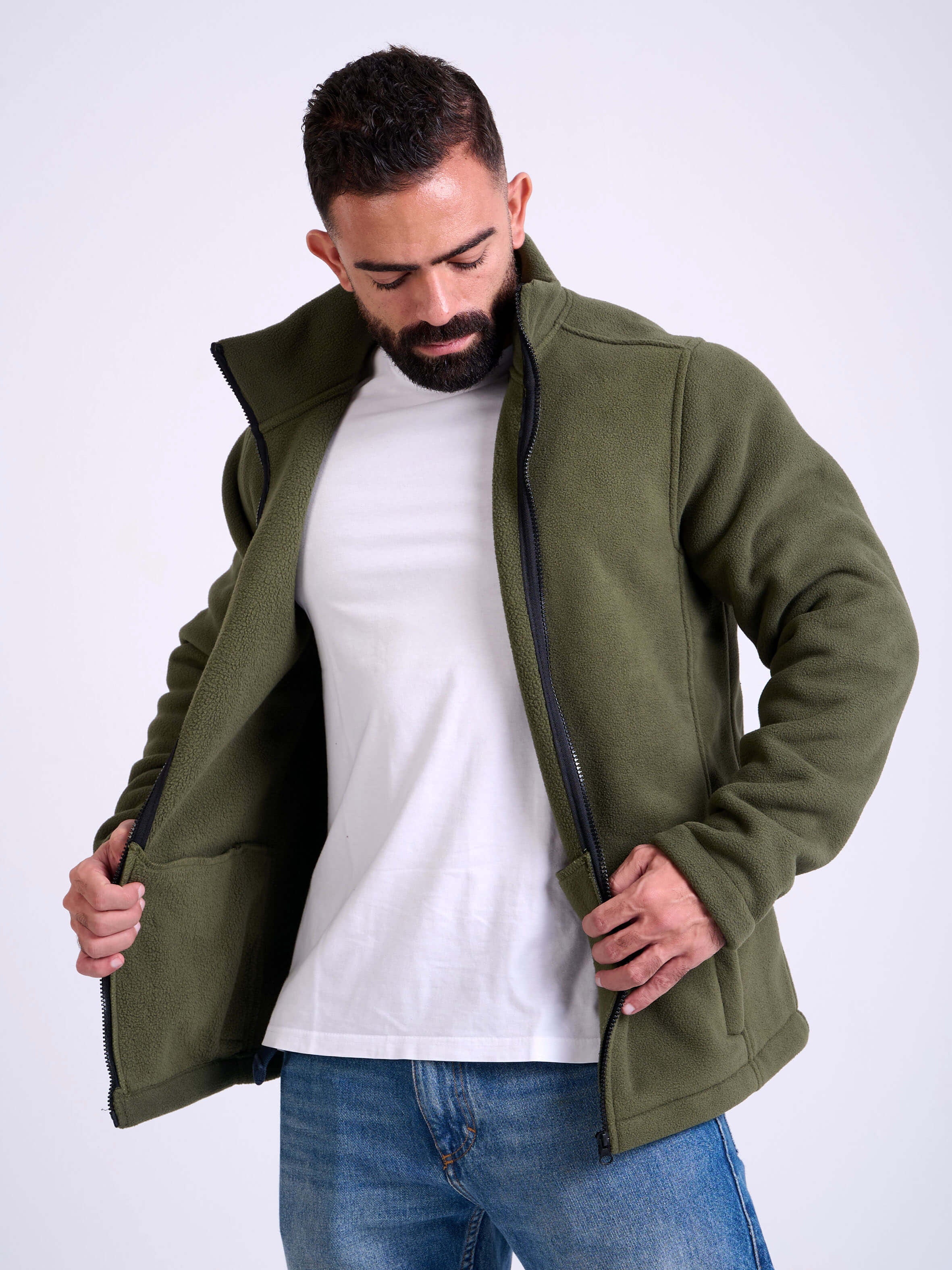 Man wearing a olive fleece jacket by KAF on a white background. Made in Egypt