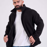 Man wearing a black fleece jacket by KAF on a white background. Made in Egypt