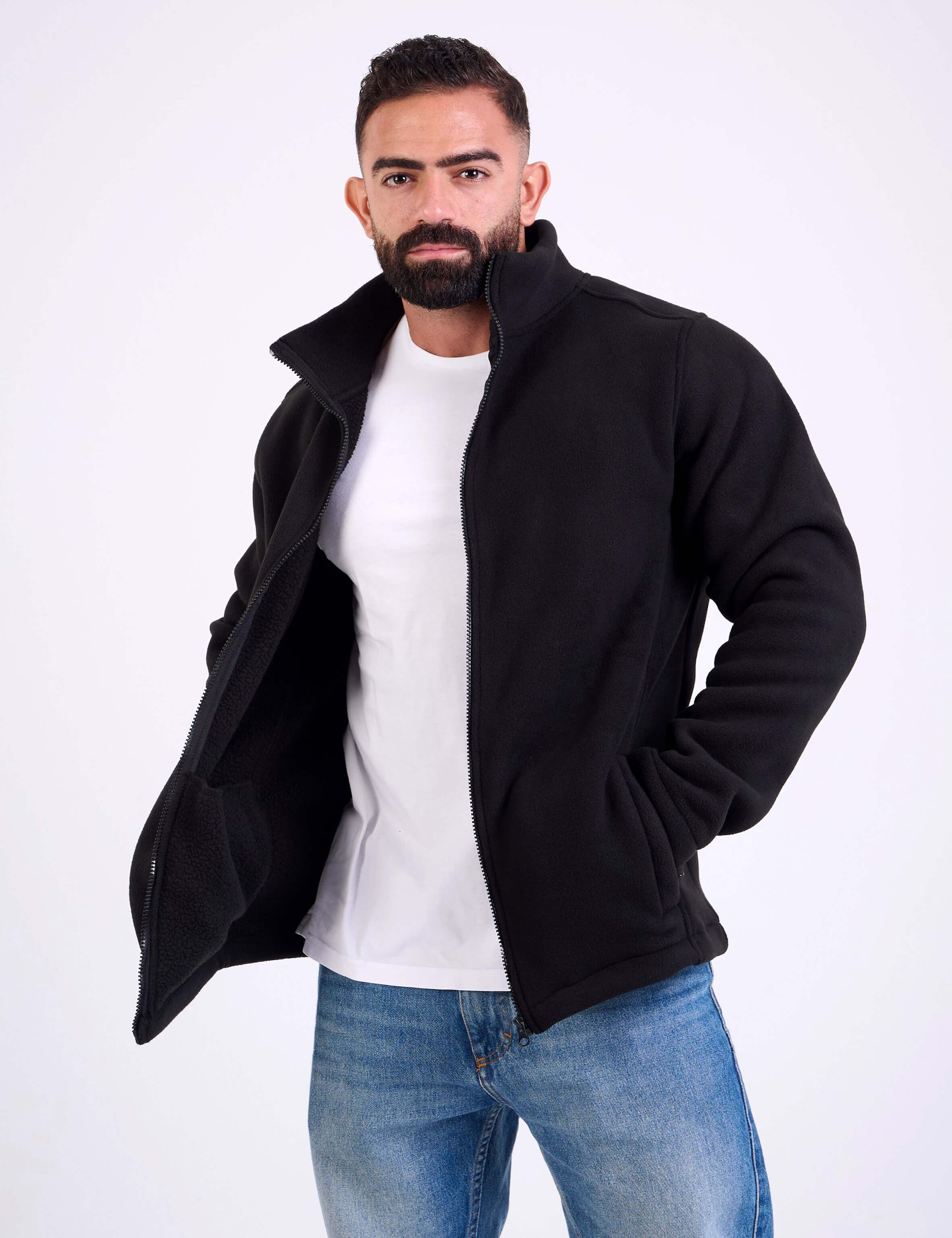 Man wearing a black fleece jacket by KAF on a white background. Made in Egypt